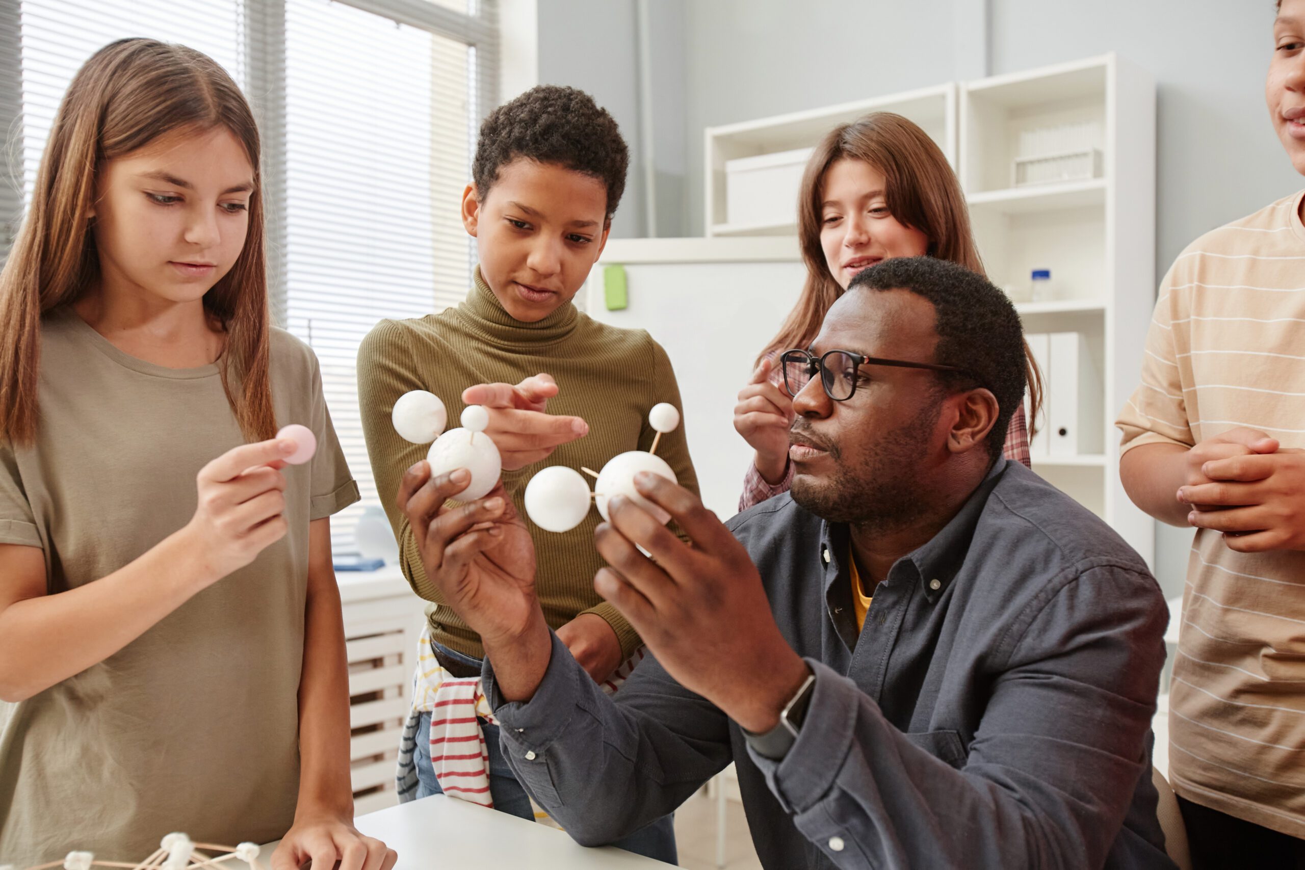 Teacher with Group of Kids in Science Class